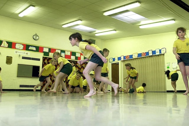Breck Primary School youngsters exercising in the hall, 2001