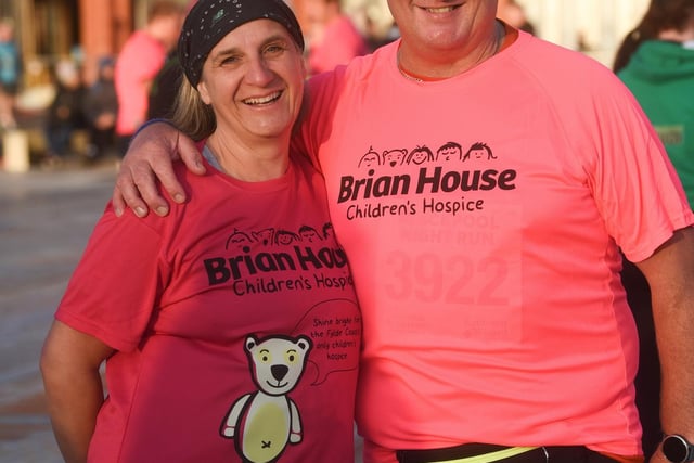 two runners eager to show their support for Brian House in the Blackpool Night Run.