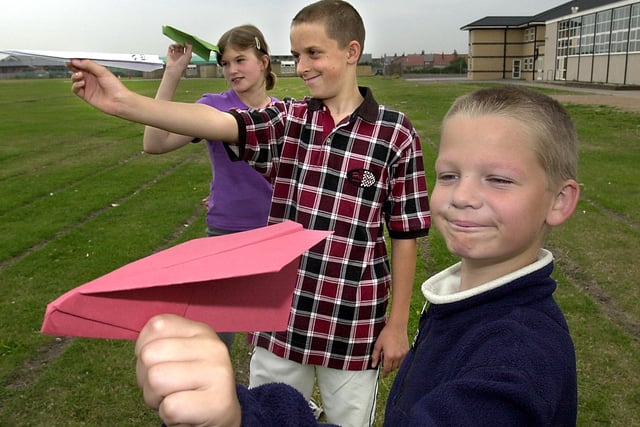Summer School paper aeroplane making competition at Palatine High School. From left, Jacqueline Thomas (13),  Chris Downes (13) and Aaron  McLellan (11) in 2001