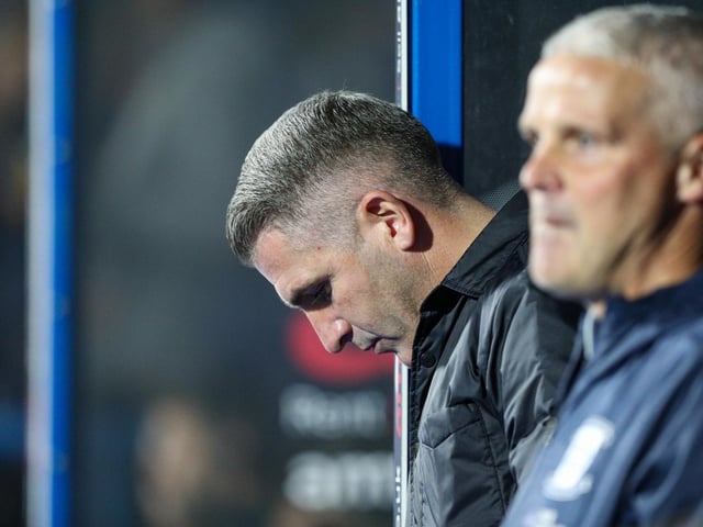 Preston North End manager Ryan Lowe takes a seat in the dug out.
