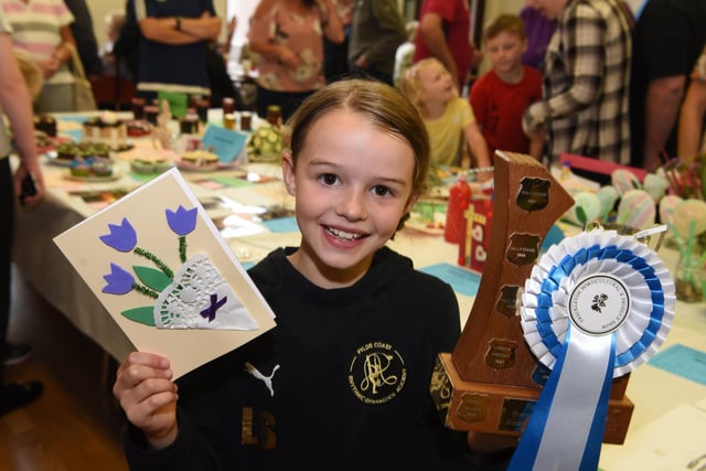 Lucy Stone celebrates wining the children's aggregate prize at Freckleton Horticultural Show. Picture: Neil Cross.