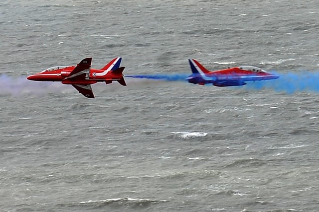 The Red Arrows perform their cross-over in 2013