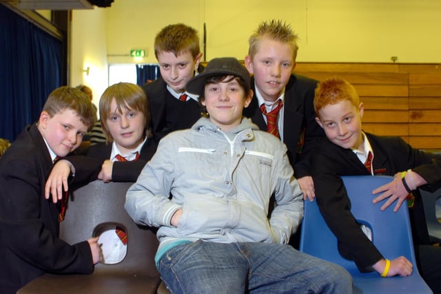 Li'l Chris (centre) performing at Beacon Hill High School, Blackpool.  Pictured with Chris are L-R George Meredith, Reece McDowall, Luke Arnold, Joe Hugill and Mark Owen
