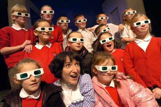Children from Morecambe Bay Primary School wearing 'magic' green glasses at The Wizard of Oz final dress rehearsal with Dorothy - Alexander Maher