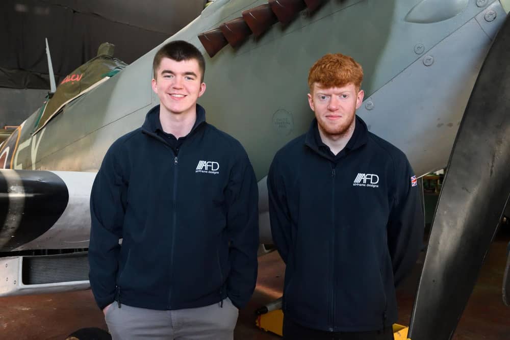 Apprentices Adam Snelson (left) and Ben Porter with the Spitfire
