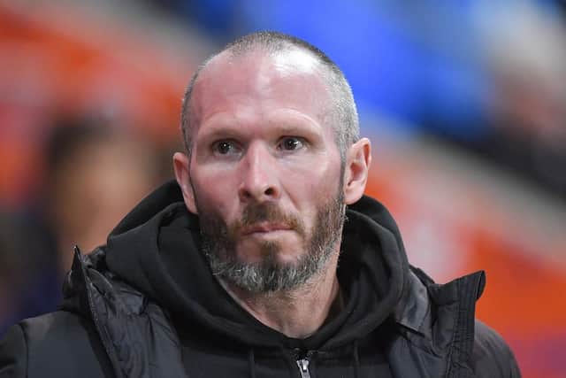 Michael Appleton will be without a number of first-team players at Wigan this weekend