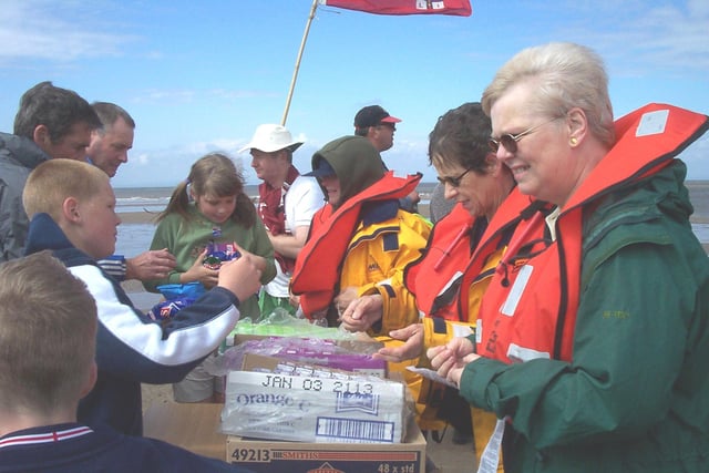 Fleetwood Lifeboat fundraising volunteers Linda Musgrave, Margaret Thompson and Susan Pearce greeted Wreck Trek walkers at Wyre Light with a 'shop' selling refreshments. It was 2002