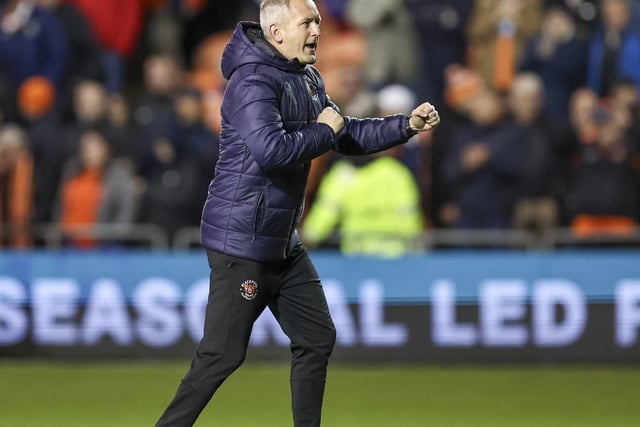 Neil Critchley applauds the fans following the final whistle.