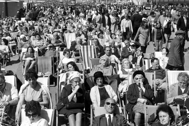 Every deckchair was taken in this classic picture of Blackpool promenade on a Whit Monday  in the 1960s. Can you spot the knotted handkerchief and the hot pants among the hordes enjoying an early summer siesta