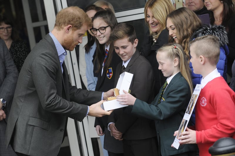 Prince Harry visits Veterans UK at Norcross. 11-year-old Phoebe Taylor from Shakespeare Primary with the poppy badge presented to Prince Harry.