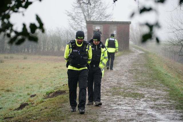 Police officers near the River Wyre. Photo: Peter Byrne/PA Wire