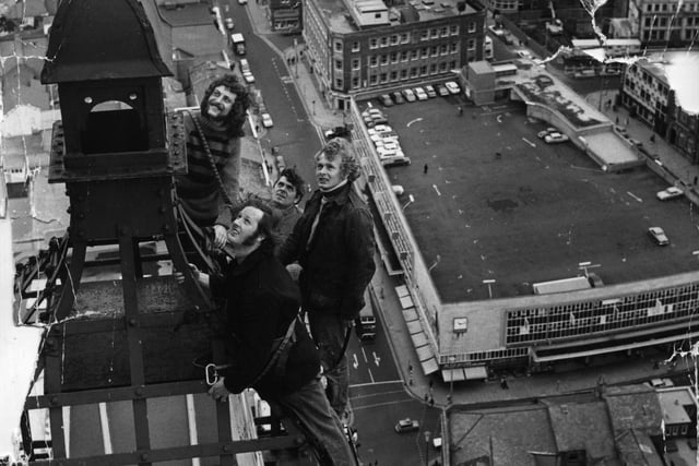 Photographed 518 feet above Blackpool are (from left ) electricians Dez Clark, Bert Roberts, Paul Hopton and David Neath during their annual task of fittig the Illuminations to Blackpool Tower. The photograph was taken from the crows nest by Evening Gazette photographer Peter Owen in 1973