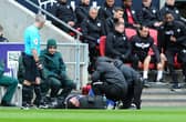 Madine required medical treatment after landing awkwardly on his knee