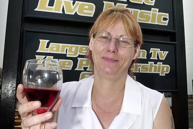 Uncle Tom's Cabin on Queens Promenade North Shore had new licensees in 2003. Pictured is Deborah Boyd-Williams drinking to the success of the re-vamped Cabin
