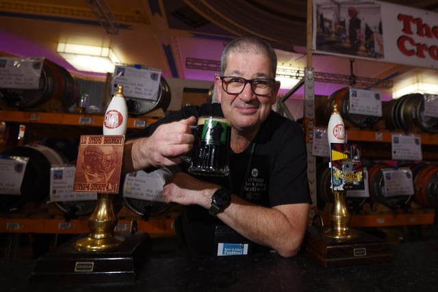 Rick Pickup serves a pint.