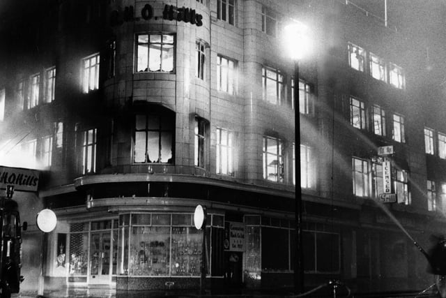 The caption on this photo states: "Within little over an hour the whole building had become involved and the Adelaide Street corner too, was a mass of flames"