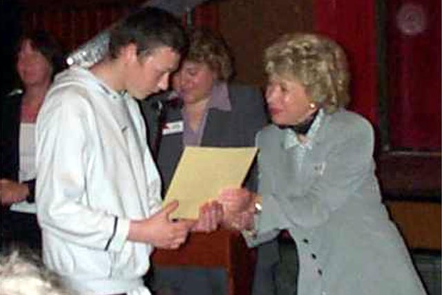 Blackpool and the Fylde College principal Pauline Waterhouse hands an award to a student at the Marine Hall in Fleetwood