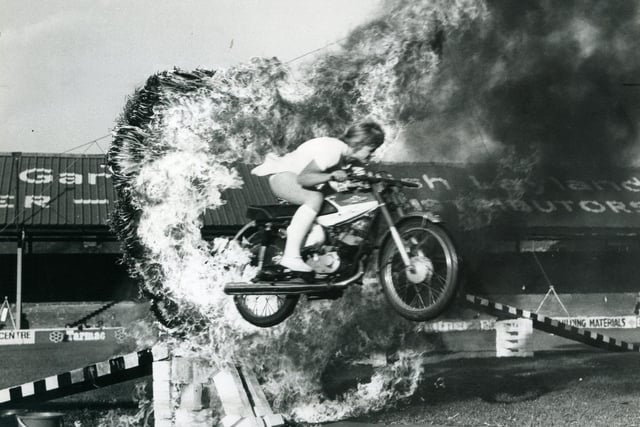 The Trabor Family Great Daredevil Circus at Blackpool Football Club, Bloomfield Road in 1975. A member of the Moto Birds team crashing through a ring of fire at top speed