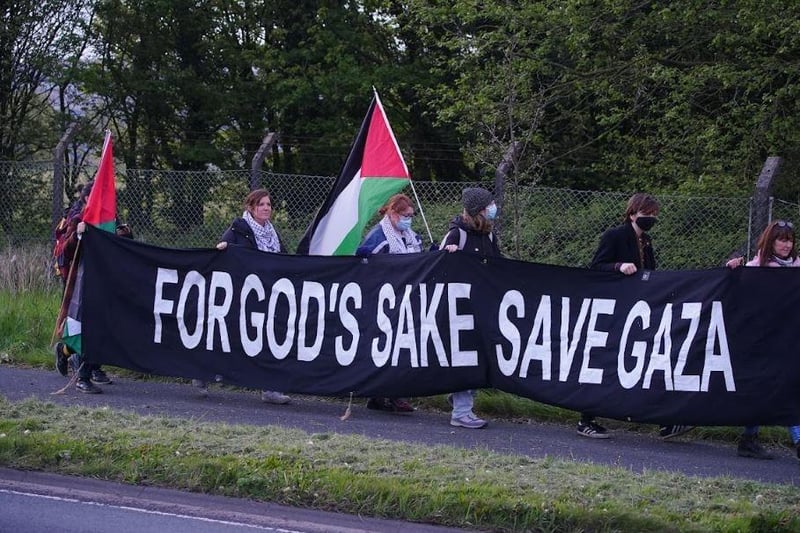 Carrying a 'For God's sake save Gaza' banner.