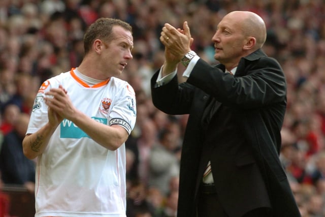 Adam and Ian Holloway applaud the Blackpool fans at Old Trafford as their relegation is confirmed