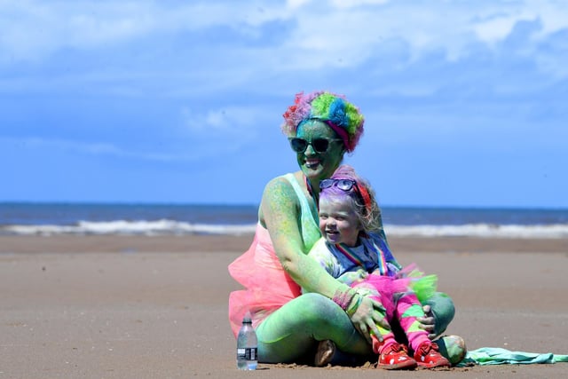 Time to take a brief rest for this mum and daughter as they admire the setting for the Blackpool Colour Run