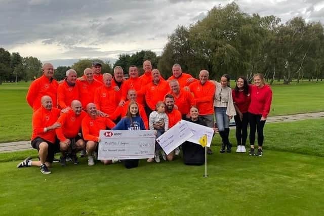 The golfers presenting a cheque to Cheryl Gregson at Lytham Green Drive Golf Club