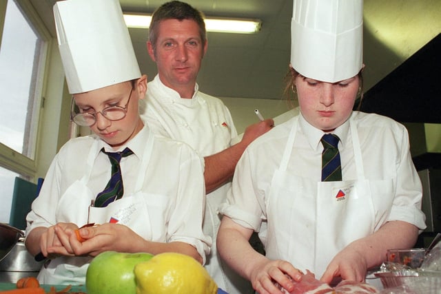 Young chef of the year competition at Blackpool and the Fylde college, Bispham. Kristopher Evans (13) and Stacey Naylor (13) prepare their meal under the watchful eye of judge, Michael Golowitz from Septembers Brasserie