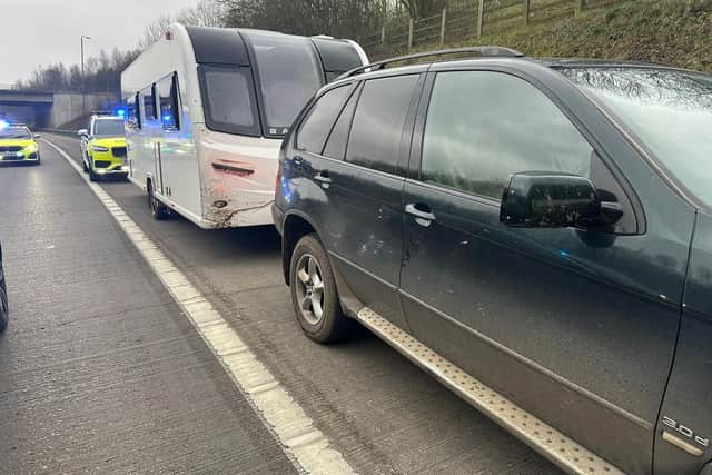 Police stopped this BMW towing a suspected stolen caravan on the motorway and found an 11-year-old schoolboy at the wheel.
