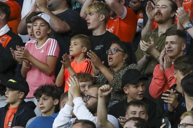 Blackpool fans sing as they watch their team in action