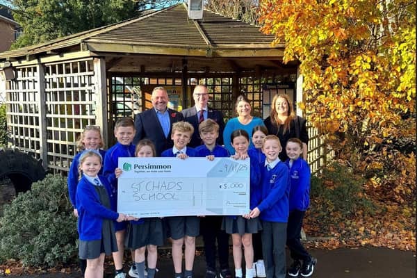 Pupils of St Chads with teachers, Councillor Alf Clempson and Persimmon Lancashire MD, Anthony Mansf. Photo: Persimmon