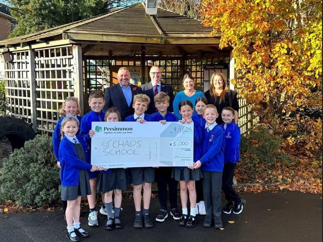Pupils of St Chads with teachers, Councillor Alf Clempson and Persimmon Lancashire MD, Anthony Mansf. Photo: Persimmon