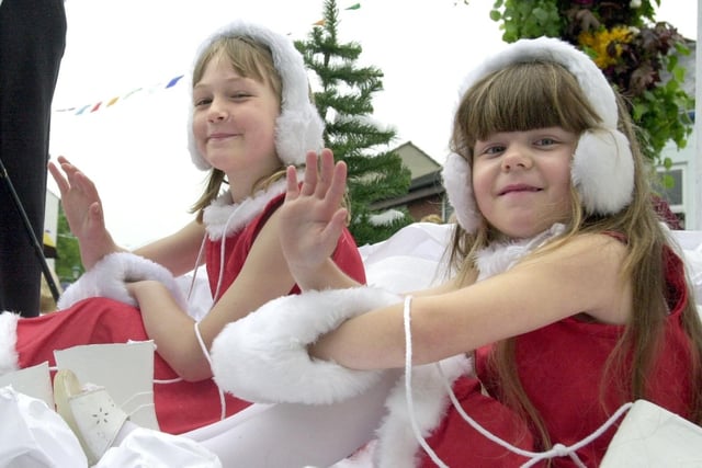 A taste of winter... Nateby Primary School snow girls Rebecca Keighley, aged eight (front), and Analee Chalioner, five, on board their 'Winter Wonderland' float during Garstang Children's Festival