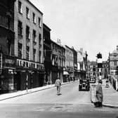 Market Street. Hymans and Leonard Dews jewellers on the left and the site of the old St John's Market is just visible on the right where BHS would be built
1953