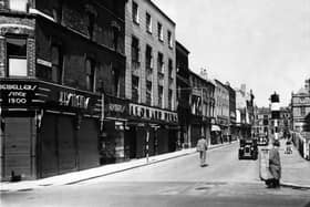 Market Street. Hymans and Leonard Dews jewellers on the left and the site of the old St John's Market is just visible on the right where BHS would be built
1953