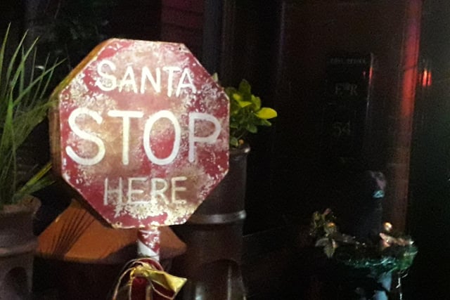 Santa stops at Michael Smith's North Shore front garden, as the sign says!