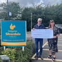 Michael Holgate from Holgates Holiday Parks with Sue McGraw, Chief Executive of St John's Hospice