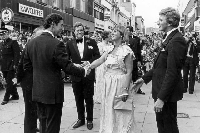 Arriving at The Grand Theatre, Prince Charles is greeted by Mr & Mrs Geoffrey Thompson and John Broadbent, chairman of Friends of the Grand at the theatre's re-opening in 1981