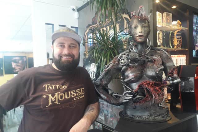 Tattoo artist Shamack Malachowski at the Inkden tattoo studio in Blackpool