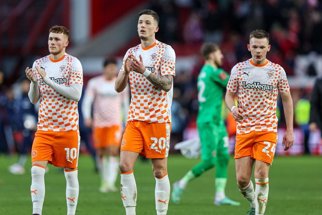 The Blackpool players applaud the fans at full time.