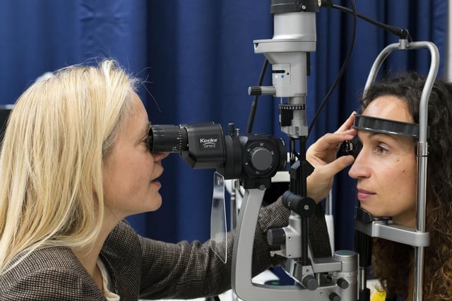 Eye examinations under guidance from an academic.