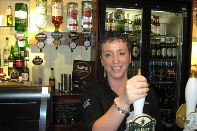 Pulling a pint in The Washington pub in Topping Street