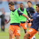 Theo Corbeanu and Kenny Dougall will both find out their World Cup fate this coming week