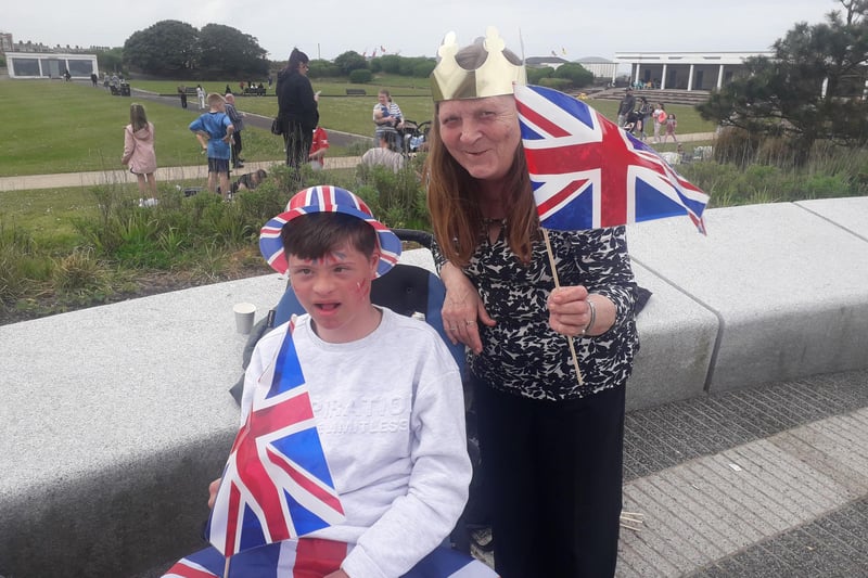 Susan Crook waves a Union flag with grandson Ethan Christie