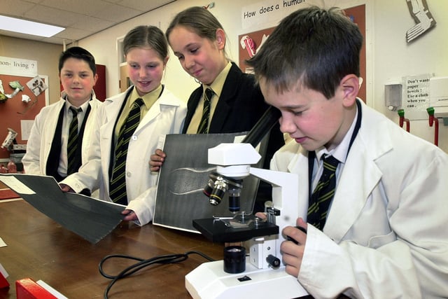 Lytham St Annes High School science teacher Cathy Simcoe staged a mock murder for pupils to investigate using proper forensic methods in 2001
Ashley Cardwell, Emily Parker and Samantha Sinclair compare shoeprints, while Kyle Dickson checks fibres under the microscope