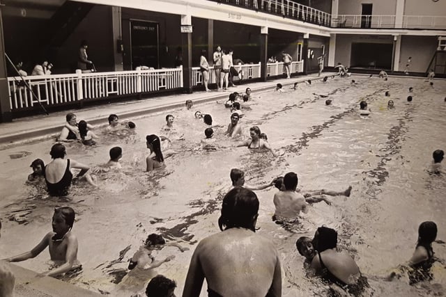 A busy scene of the pool in July 1981 - are you in the picture?