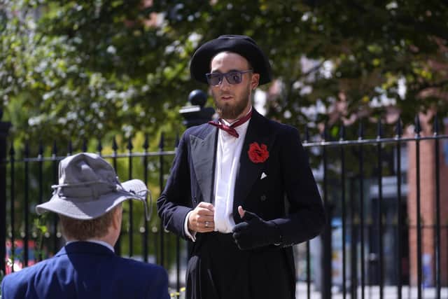 A mourner dressed as Jimmy Cricket arrives for the funeral of stand-up comedian Jimmy Cricket at Salford Cathedral, Greater Manchester.