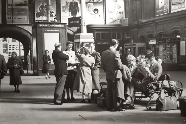 A lost moment in time as passengers wait for their connection. This was May 30 1955