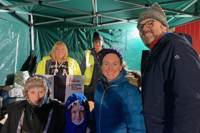 Visitors to Poulton Bonfire Night stop off at the drinks stall run by Rotarians