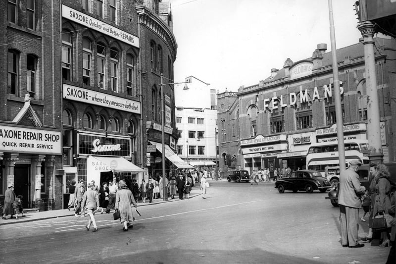 Feldmans Theatre and the Stanley Buildings (left) now the site of Coral Island. People on the right are standing outside Central Station