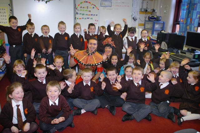 Stars from Blackpool Tower's pantomime Aladdin visited Roseacre School in South Shore to tell a class that because Lily-Ebony Ganchi had won a competition the whole class has won a trip to the pantomime. Pictured are Claire McDowall as the Princess and Bubu Andresz as the Genie with happy pupils